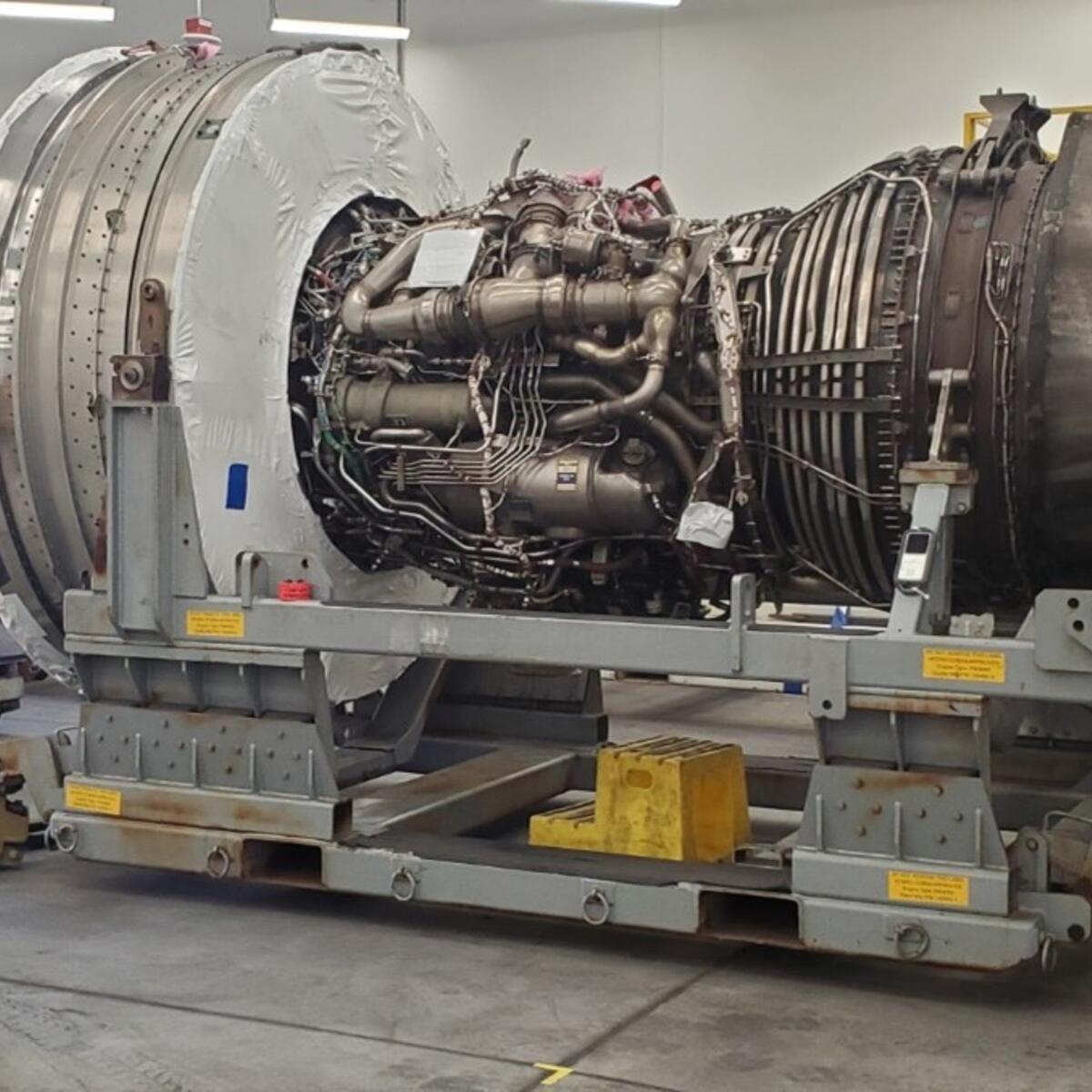 Jimmy posing in front of aircraft engine