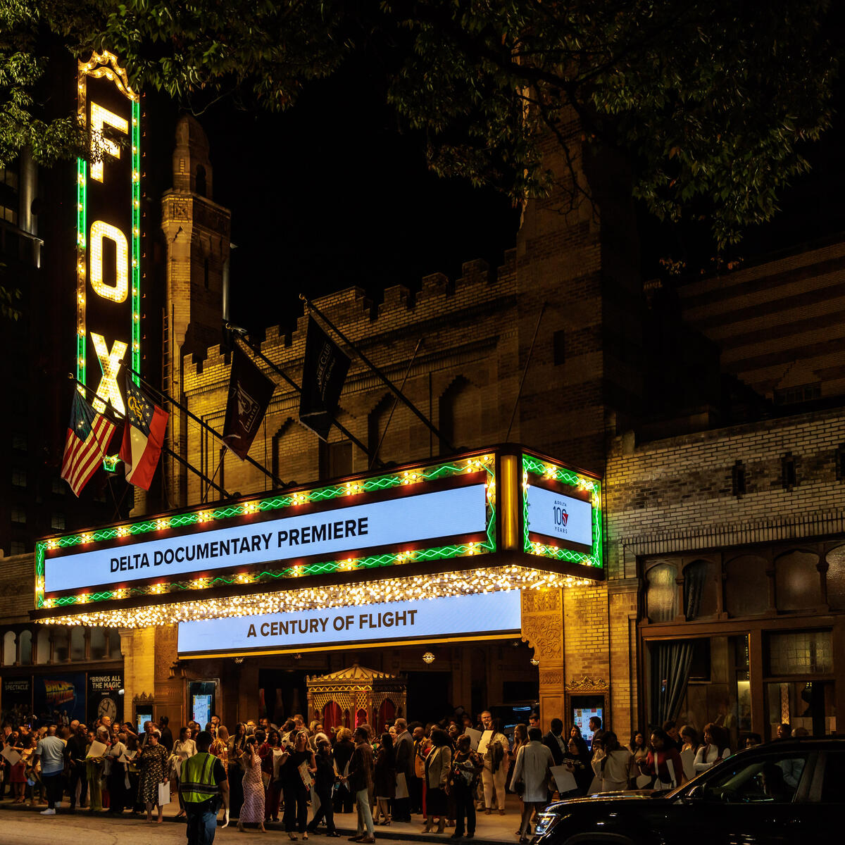 Exterior shot of the Fox Theatre at night with Delta documentary premiere on the marquee.