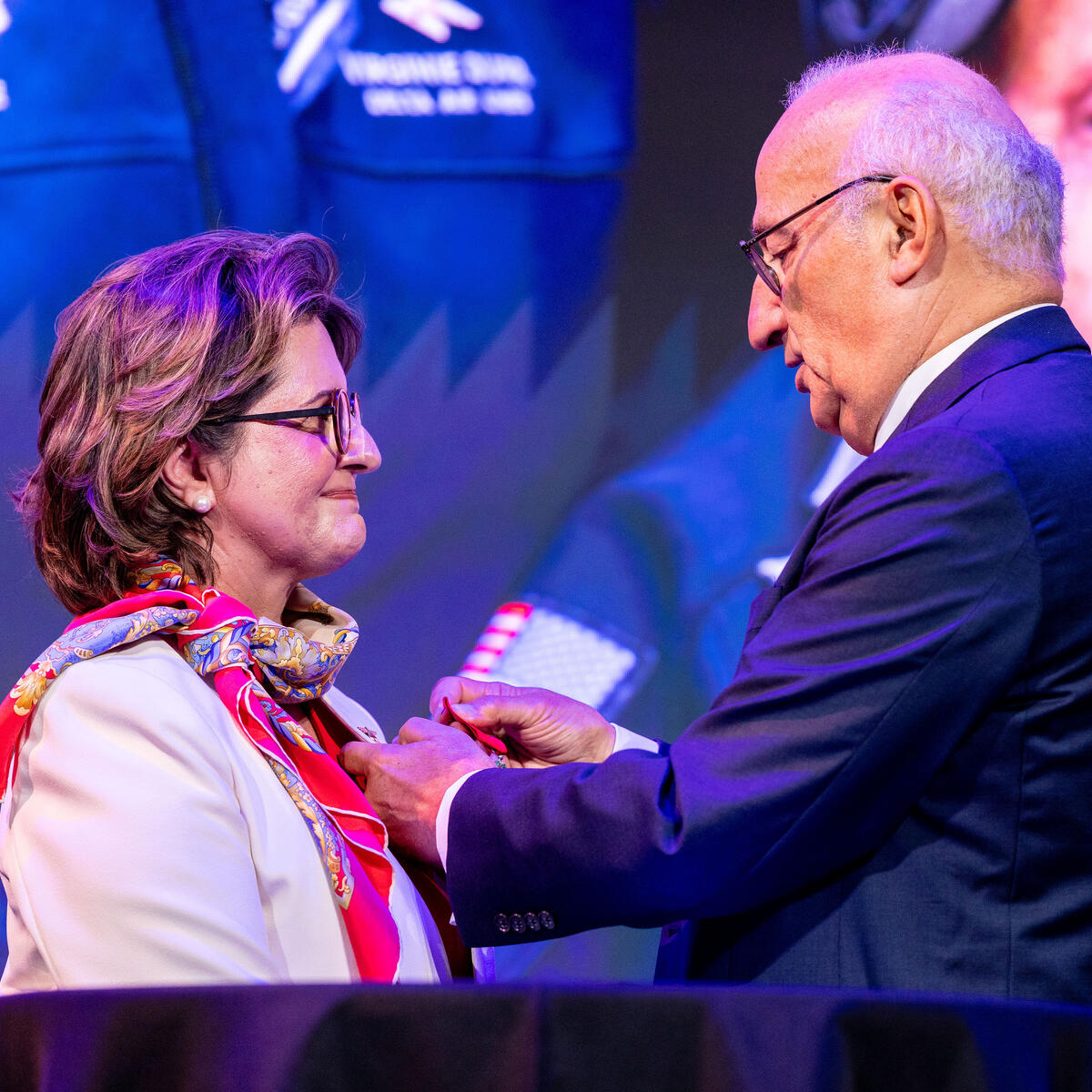 Ambassador of France Philippe Étienne presents French Legion of Honor to Virginie Durr.