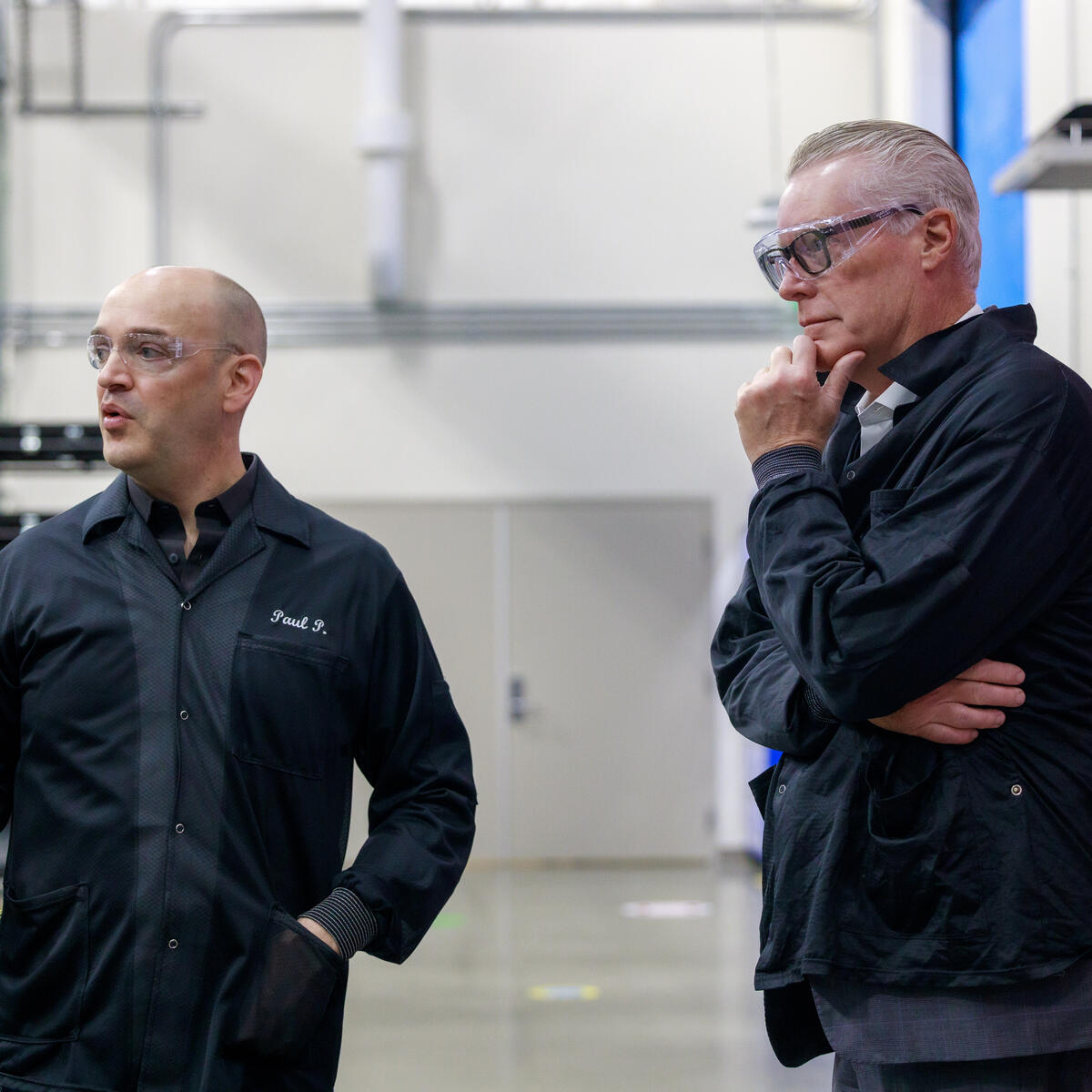 Ed Bastian and Amazon Leo employee standing in industrial facility.