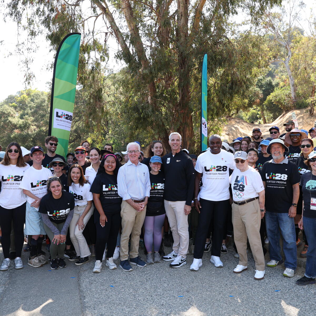 A group of Delta Air Lines volunteers pose for a picture in a Los Angeles park after finishing a community event.