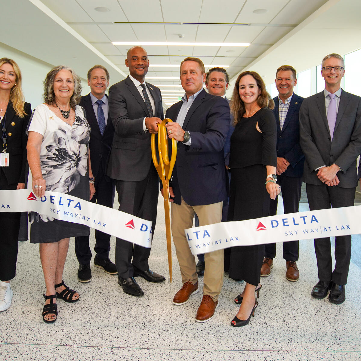 The ribbon cutting for the unveiling of Delta and Los Angeles World Airports' final major phase of the Delta Sky Way at LAX project.