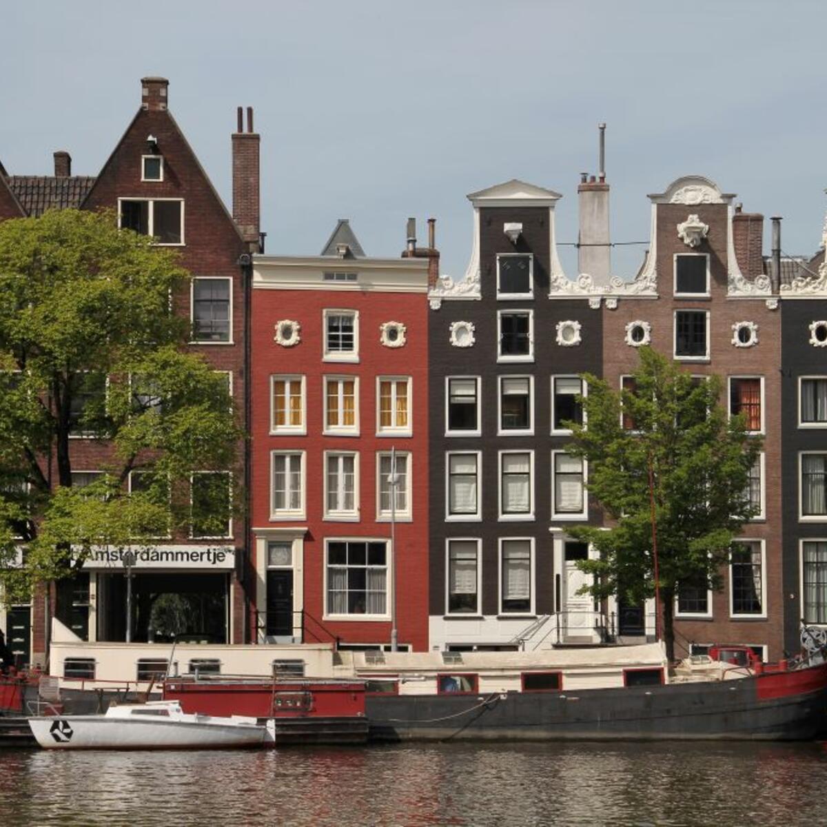 A canal in Amsterdam lined with 17th century homes.
