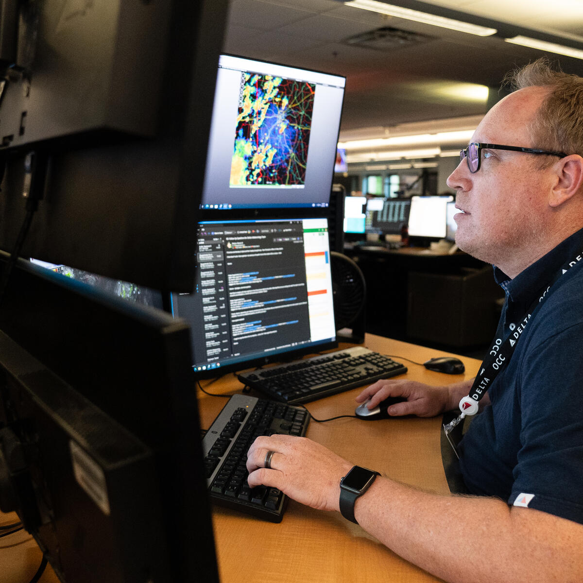 Warren Weston, a member of Delta's in-house meteorology team, working inside the Operations and Customer Center in Atlanta.