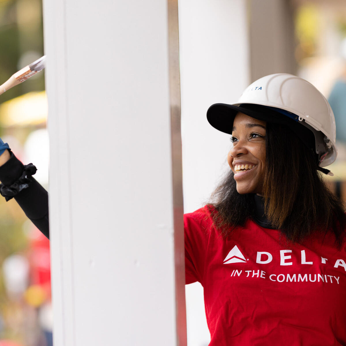 A Delta employee volunteers with Habitat for Humanity.