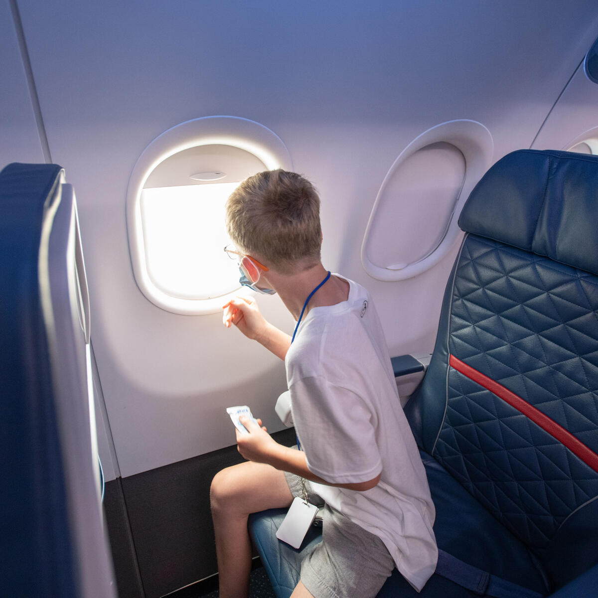 A child with autism sits in a seat on board the faux aircraft designed as part of the Navigating MSP program.