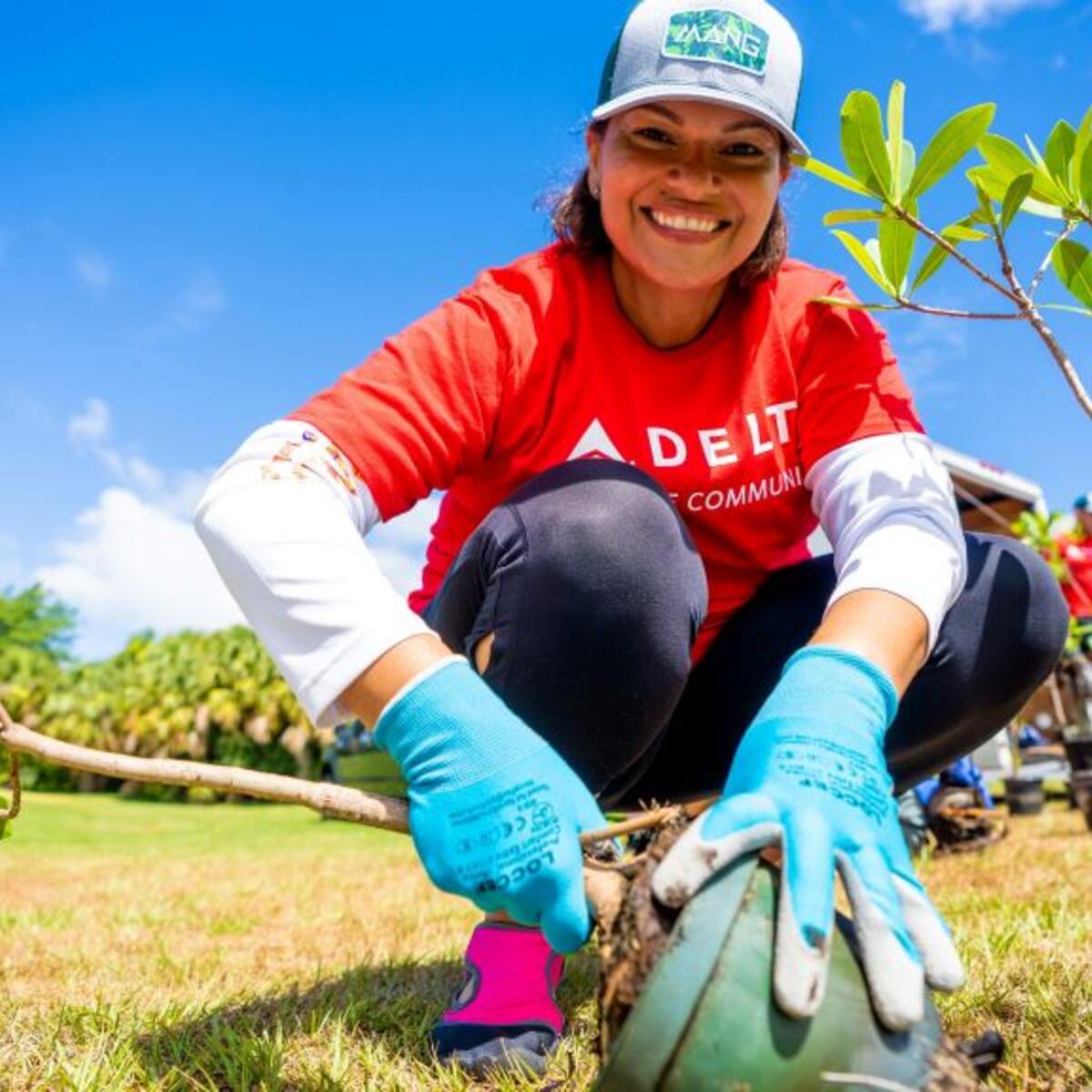 Delta people help plant trees in Palm Beach.