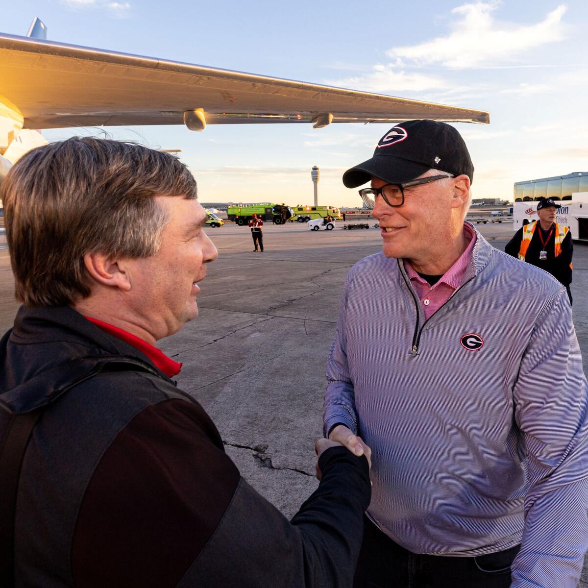 CEO Ed Bastian greets UGA head coach Kirby Smart on Jan. 10, 2023.
