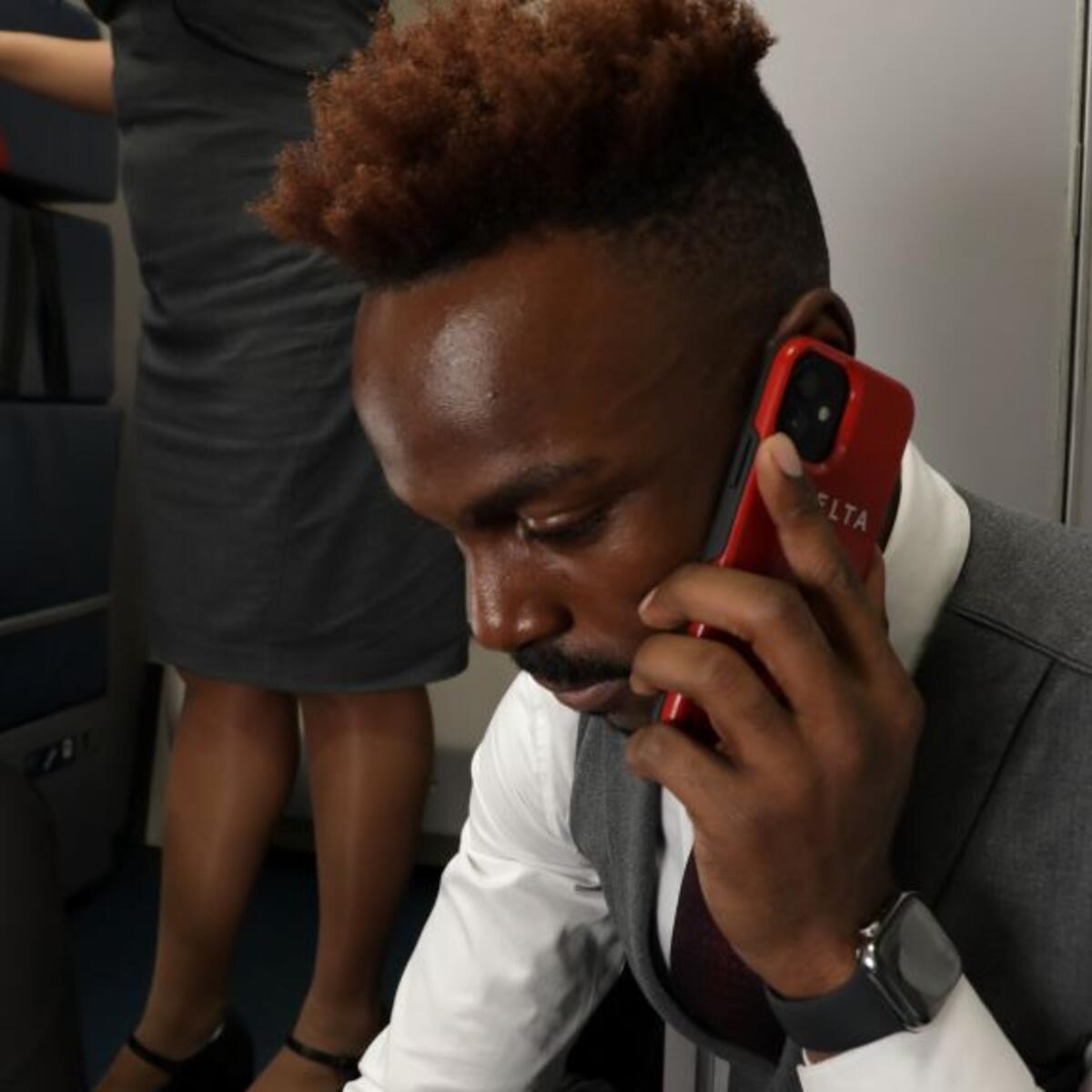 A Delta flight attendant speaks with a medical professional using their SkyPro mobile device.