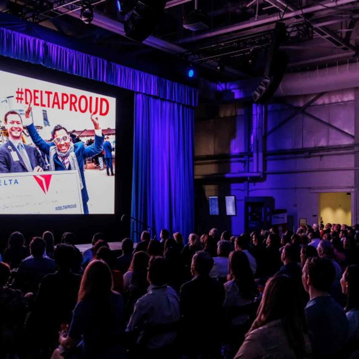 Delta employees watch the screening of Delta's documentary "The Steepest Climb."