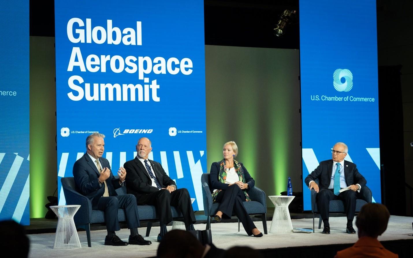 Capt. Patrick Burns (left) speaks on a panel at the U.S. Chamber of Commerce Global Aerospace Summit in September 2022.