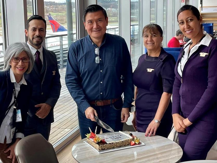 Todd O. celebrates achieving 14 Million Mile status with Delta people at Zurich Airport (ZRH).