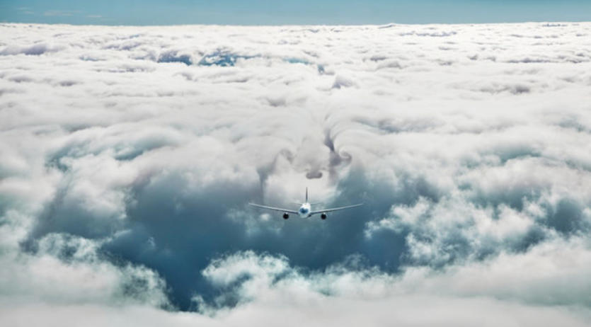 Plane flying through clouds.
