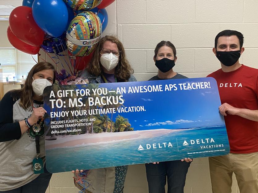 Emily Backus was surprised Friday with the gift of a summer vacation from Delta Air Lines and Delta Vacations.
