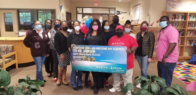 Cheryl Jamison was surprised Friday with the gift of a summer vacation from Delta Air Lines and Delta Vacations.