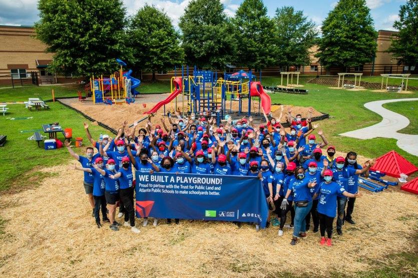 Delta volunteers build playground at Dobbs Elementary School - TPL
