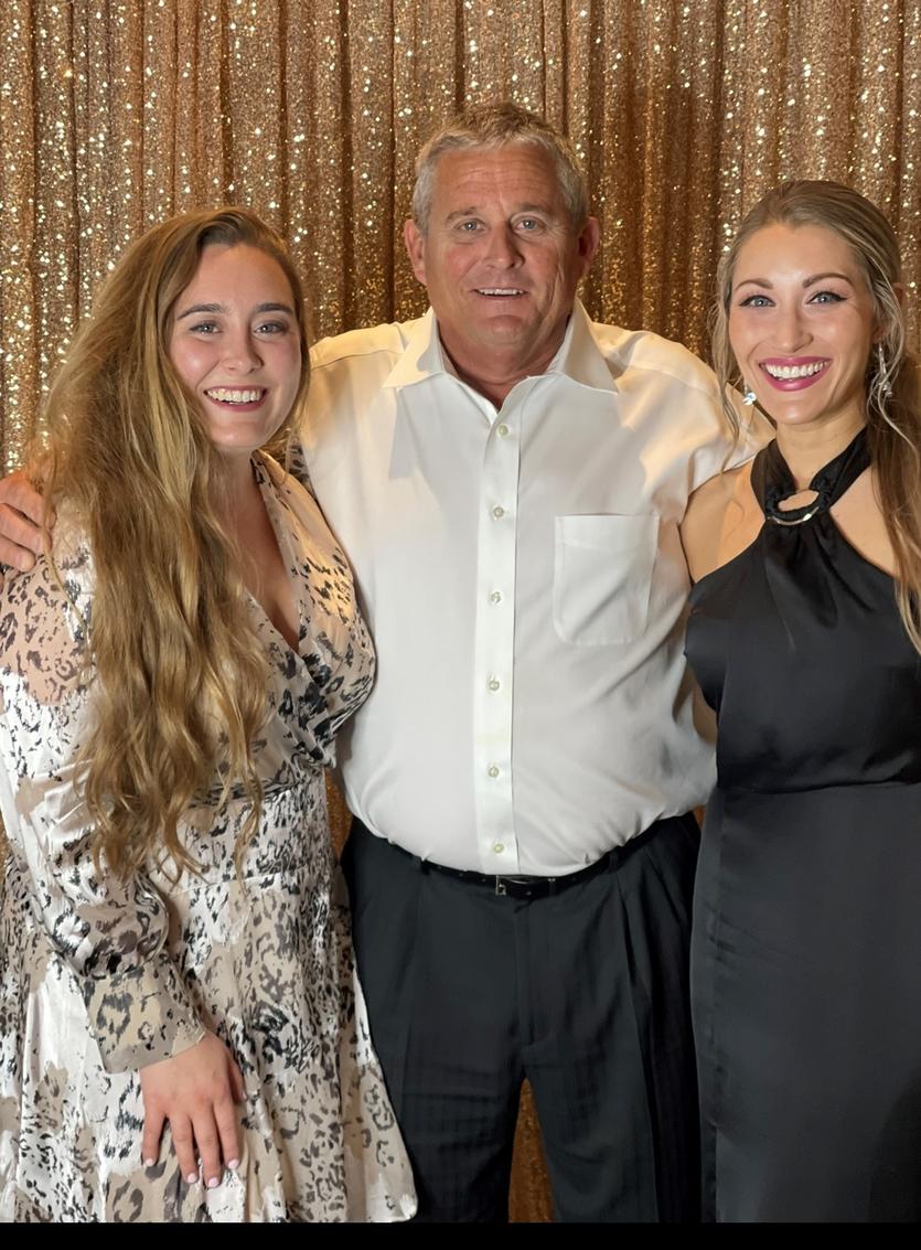 Greg Kaufmann with his daughters.