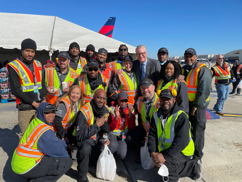 Delta CEO Ed Bastian poses with ramp crew members in Atlanta for Employee Appreciation Day.