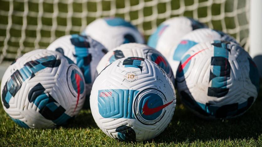 Arrary of soccer balls announcing partnership with National Women’s Soccer League 