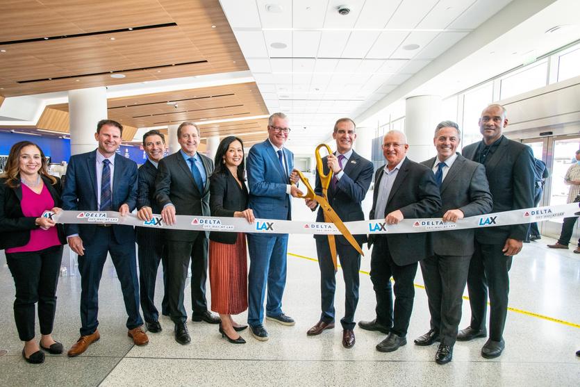 Officials at a ribbon-cutting ceremony at LAX on March 29, 2022.
