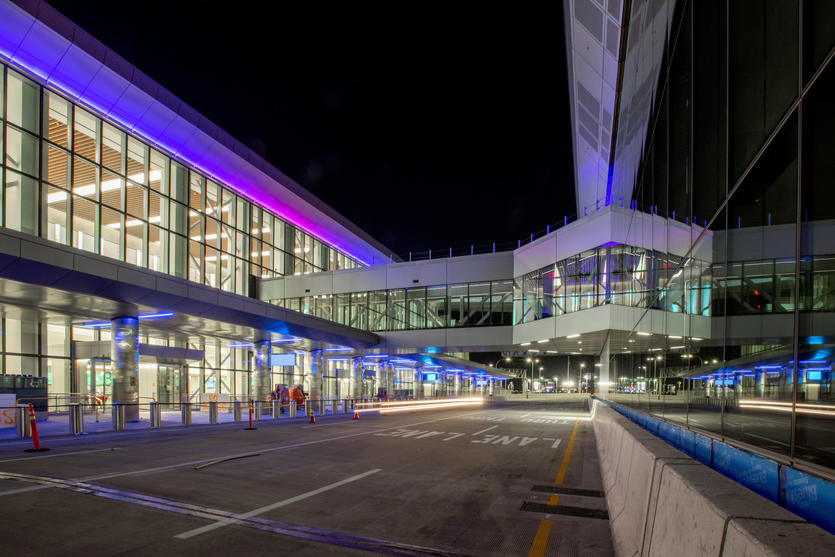 Night exterior view of Delta's LGA terminal