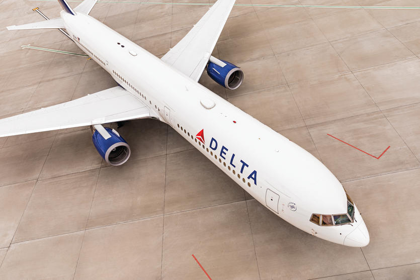 Delta's Boeing 767-400 model, over 200 feet long, navigates the runway for takeoff.