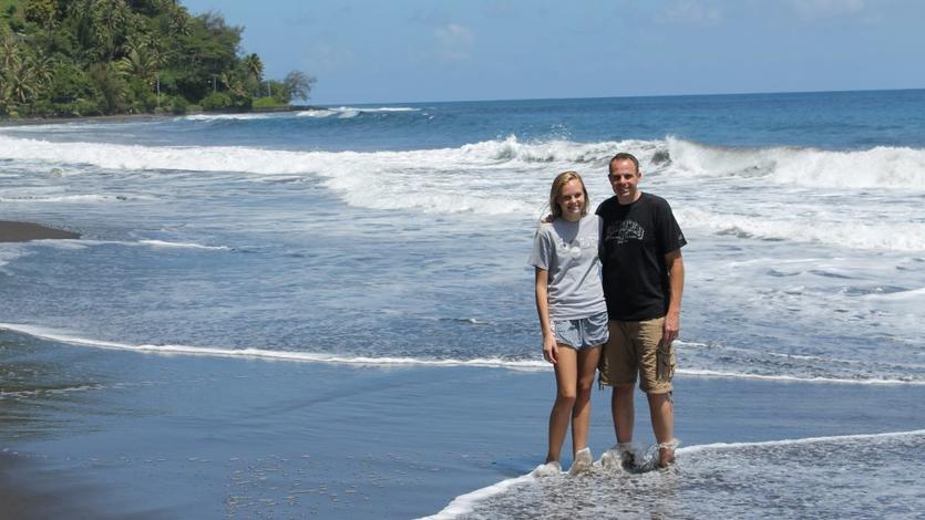 A320 Delta Captain Michael Wilkinson and his daughter stand on a beach in Tahiti.