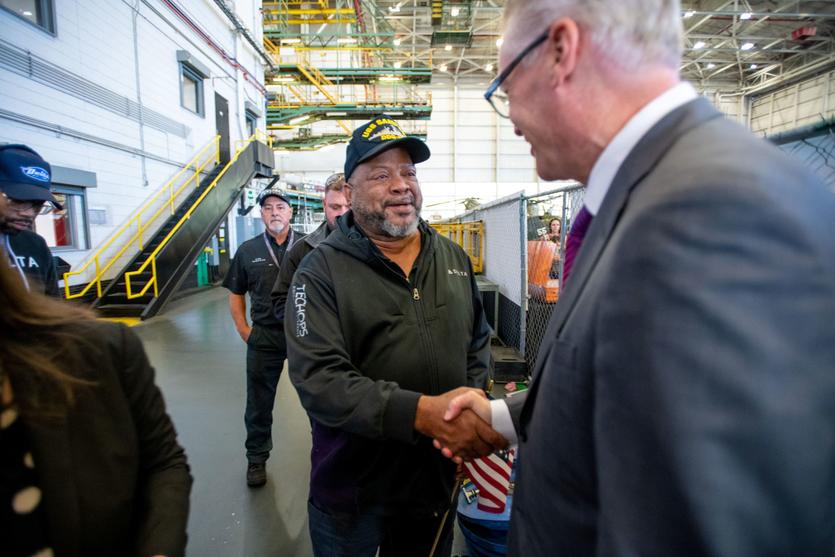 Delta CEO Ed Bastian shakes hands with one of the airline's TechOps employees at an annual Veterans Day celebration on Nov. 4, 2022.