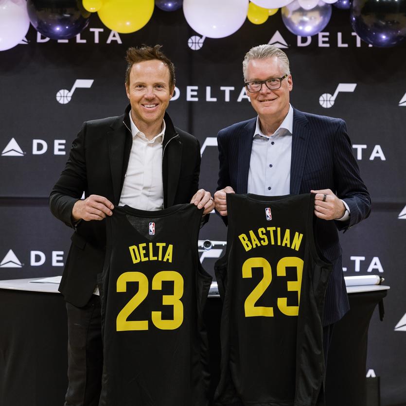 Delta CEO Ed Bastian poses with Utah Jazz owner Ryan Smith.