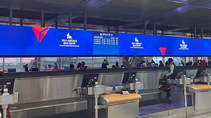 Delta's updated bag drop area at its newly consolidated Terminal 4 in New York City - JFK utilizes the latest technology to improve efficiency during busy travel times.
