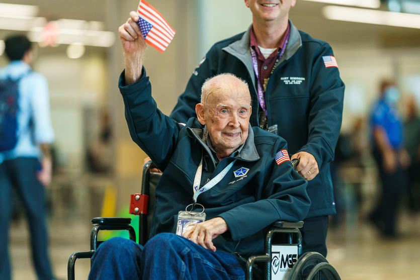 WWII veterans are greeted at the Hartsfield-Jackson Atlanta International Airport before boarding a flight to Normandy, France for the 79th annual commemoration of the 1944 D-Day invasion.  