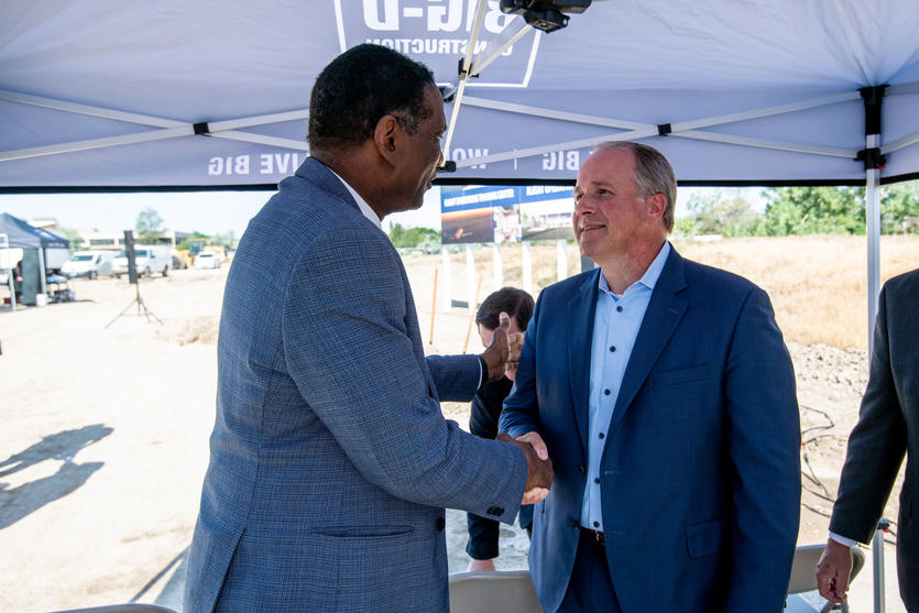Delta E.V.P. and Chief of Operations John Laughter shakes hands with Utah representative Burgess Owens at the groundbreaking of Delta's new pilot training facility in its key Mountain West hub, Salt Lake City on Thursday, June 29.