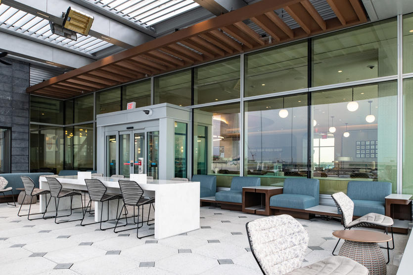 The nearly 14,000-square-foot Delta Sky Club at New York - JFK seats more than 250 guests and includes a covered Sky Deck.