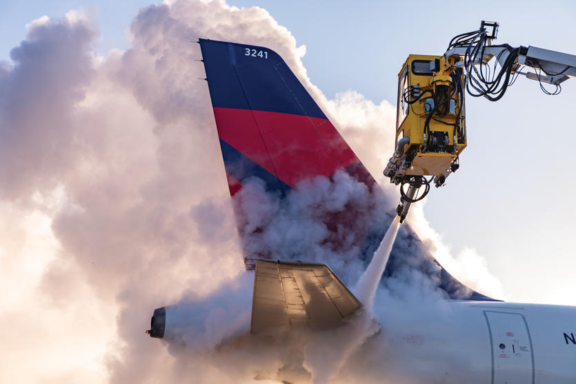 Deicing the tail of an Airbus A320 at Minneapolis-Saint Paul International Airport.