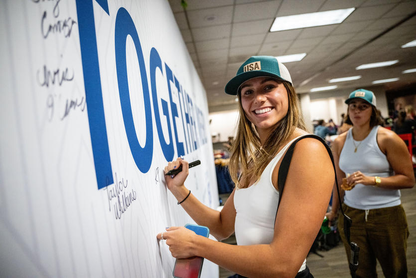 Team USA athletes sign the wall in Delta's customized athlete lounge in the ATL International Terminal.