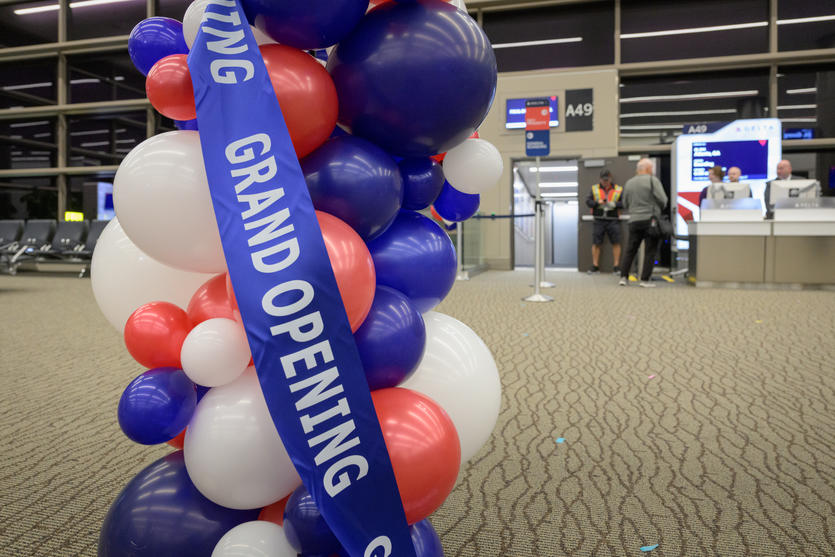 Balloons and a grand opening ribbon decorate Delta's new Concourse A expansion at Salt Lake City International Airport.