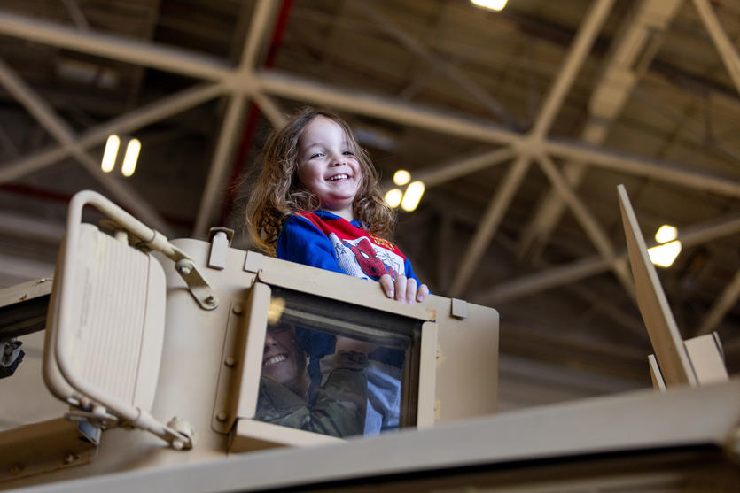 A kid enjoys one of many plane displays at Delta's 12th annual Veterans Celebration.