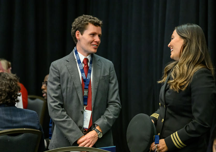 Delta employee Michael Hulse speaks with Samantha Warren, a Delta pilot and the very first Propel Company graduate.