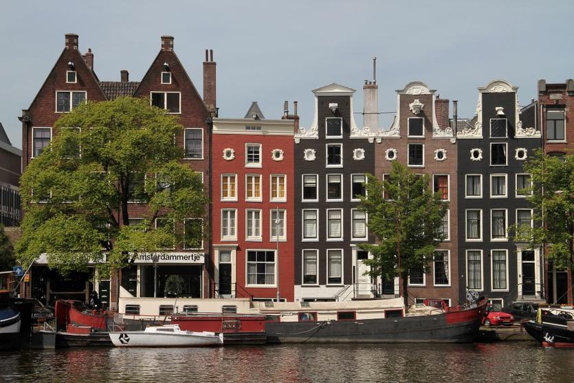 A canal in Amsterdam lined with 17th century homes.