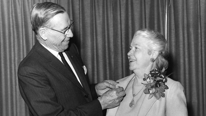 C.E. Woolman presents Catherine FitzGerald with a service pin in 1966, commemorating her 40-year aviation career.