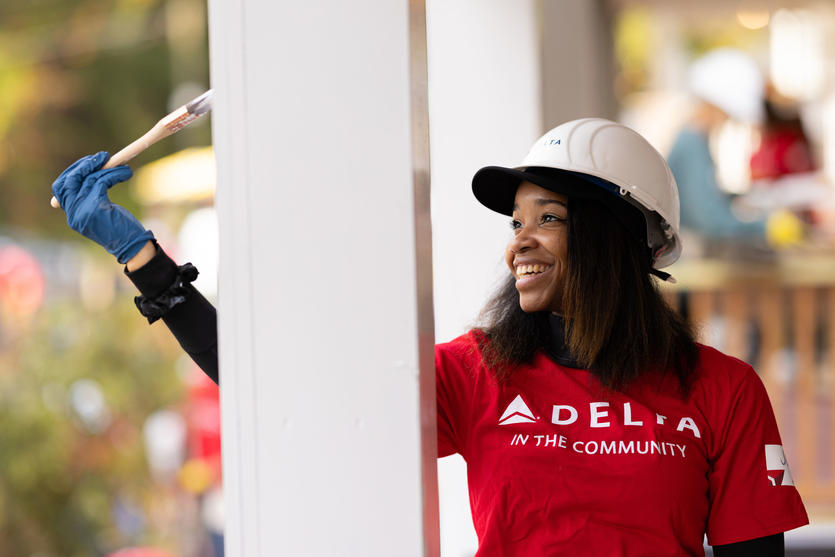 A Delta employee volunteers with Habitat for Humanity, helping build four new homes in 2023.