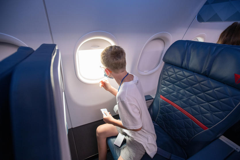 A child with autism sits in a seat on board the faux aircraft designed as part of the Navigating MSP program.