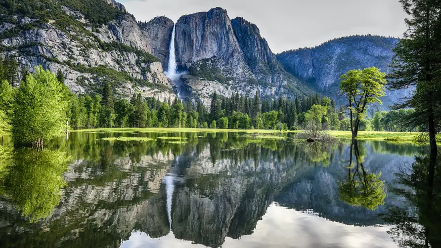 Mountains reflected in the water at Yosemite Valley in Yosemite National Park, California 