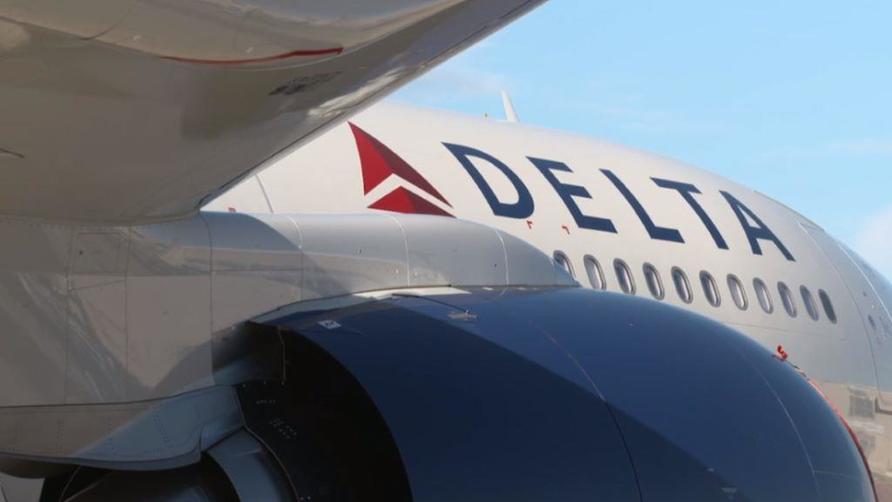 Side view of Delta A330-900 aircraft displaying Delta logo.