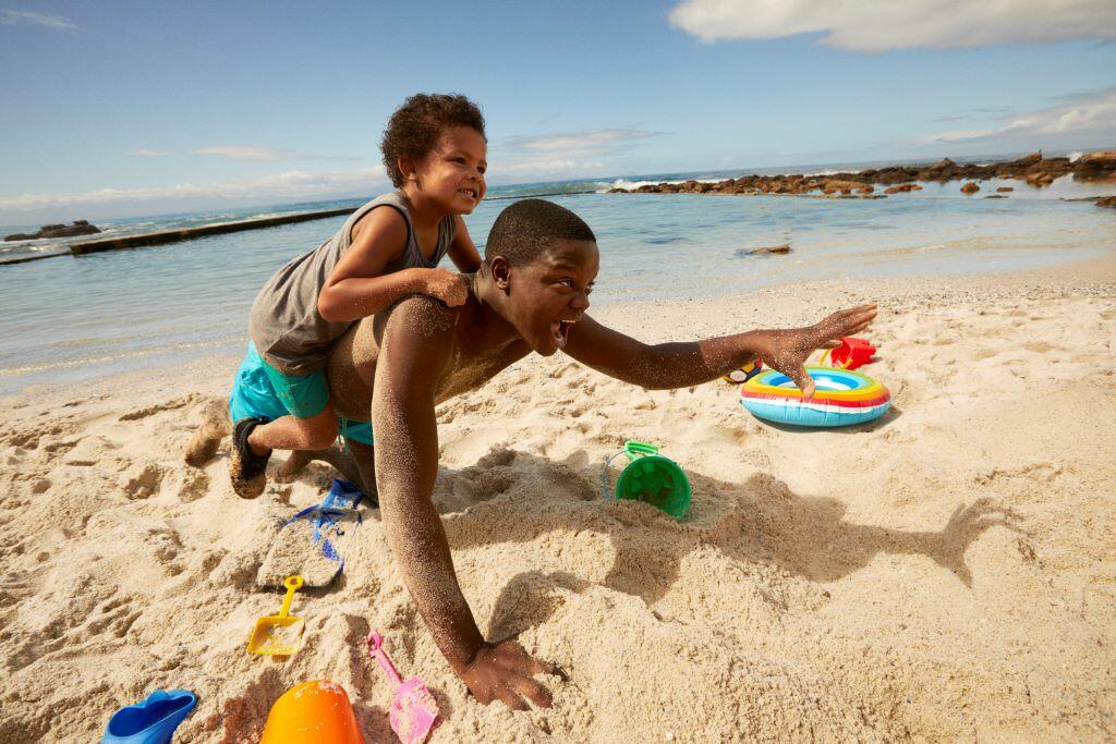 Two kids playing on the beach