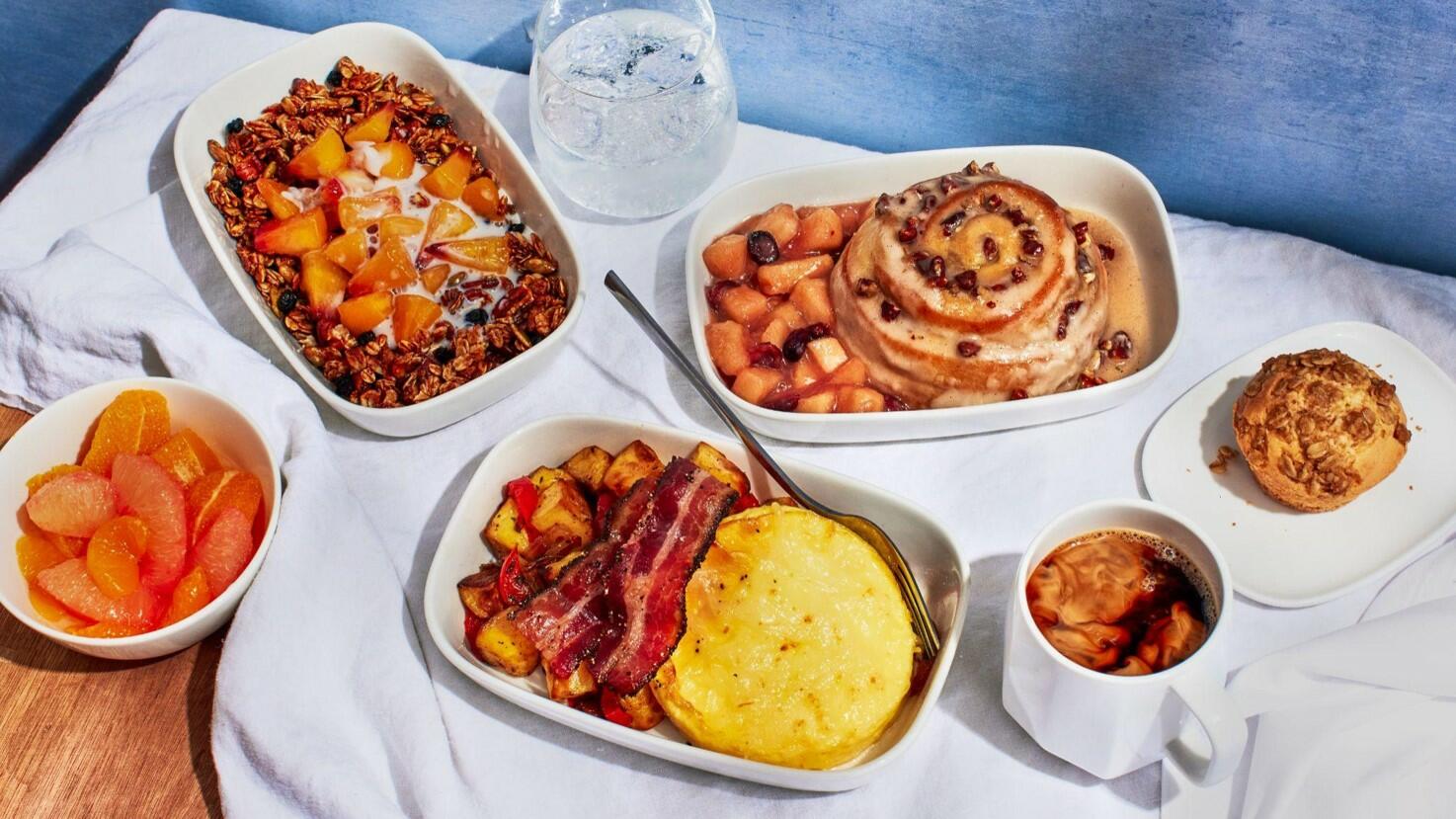 Breakfast, lunch and dinner options curated by Chef Mashama Bailey on domestic First Class flights where meal service is offered out of Atlanta. For breakfast, rise and shine with bacon and eggs with homestyle potatoes and white cheddar cheese; pecan honey bun with apple-cranberry compote; or Grey Market pecan granola with peach compote and almond milk. 