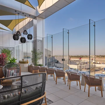 The landscaped terrace, featuring seating for 26, includes accent pillows furnished by Delta One luxury brand partner Missoni. 