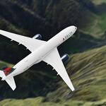 A Delta aircraft is pictured in flight.