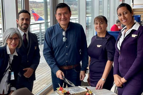 Todd O. celebrates achieving 14 Million Mile status with Delta people at Zurich Airport (ZRH).