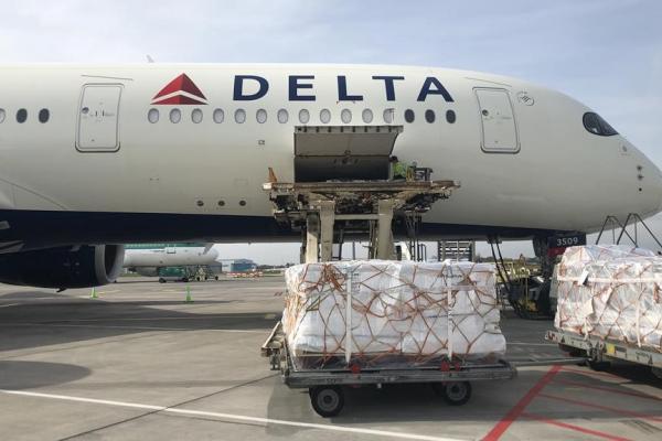 Shipments are loaded onto a Delta Cargo plane.